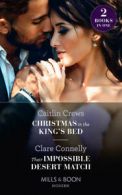 Mills & Boon modern: Christmas in the king's bed by Caitlin Crews (Paperback)